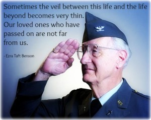 An elderly soldier saluting and a quote about loved ones by Ezra Benson.