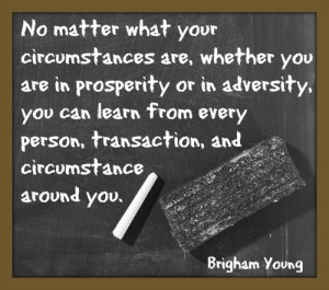 A chalkboard with chalk and an eraser. And a text quote from Brigham Young about education.