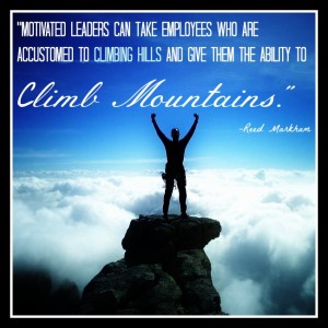 Man at top of mountain with clouds below, with quote about leaders.